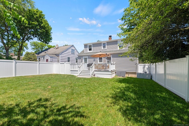 4 Harvard St, Norwalk, CT 06851 - back of property featuring a deck, a fenced backyard, a chimney, and a shingled roof