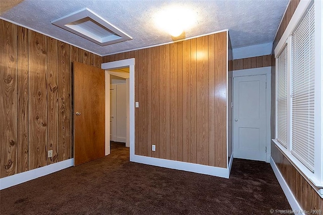 37 Landin St, Woodbridge, CT 06525 - unfurnished bedroom featuring a textured ceiling, carpet floors, and wooden walls
