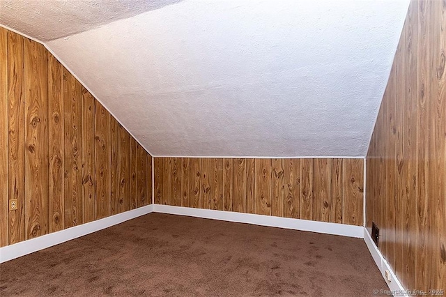37 Landin St, Woodbridge, CT 06525 - additional living space featuring vaulted ceiling, a textured ceiling, wooden walls, and carpet
