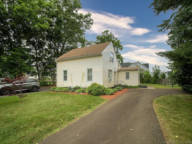 37 Landin St, Woodbridge, CT 06525 - view of side of home featuring roof with shingles and asphalt driveway