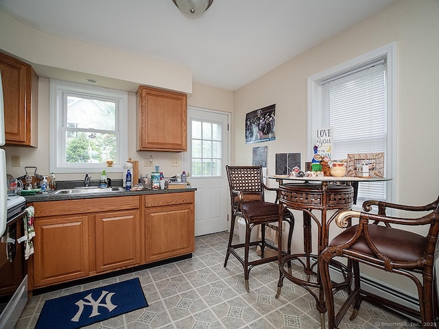37 Landin St, Woodbridge, CT 06525 - kitchen featuring dark countertops, healthy amount of natural light, white electric range oven, and brown cabinetry