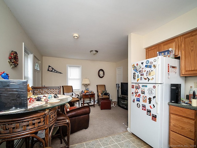 37 Landin St, Woodbridge, CT 06525 - kitchen with freestanding refrigerator, light carpet, open floor plan, brown cabinetry, and dark countertops