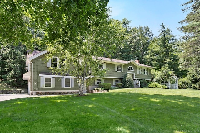 20 Aspen Mill Rd, Ridgefield, CT 06877 - bi-level home with a chimney and a front lawn