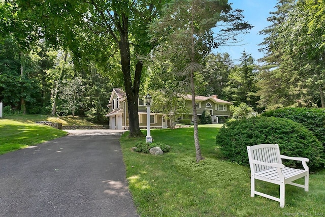20 Aspen Mill Rd, Ridgefield, CT 06877 - view of front of property featuring driveway and a front lawn