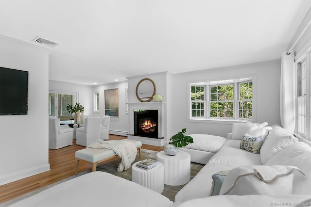 20 Aspen Mill Rd, Ridgefield, CT 06877 - living room with wood finished floors, a baseboard radiator, healthy amount of natural light, and recessed lighting