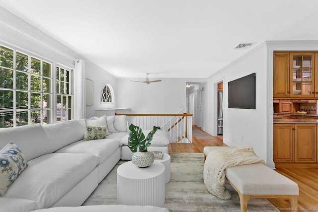 20 Aspen Mill Rd, Ridgefield, CT 06877 - living area with crown molding, light wood-style floors, and a ceiling fan