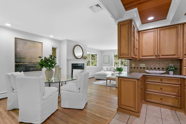20 Aspen Mill Rd, Ridgefield, CT 06877 - dining area featuring a fireplace, ornamental molding, baseboard heating, light wood finished floors, and recessed lighting