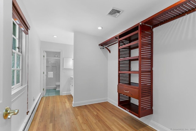 20 Aspen Mill Rd, Ridgefield, CT 06877 - spacious closet with a baseboard radiator and wood finished floors