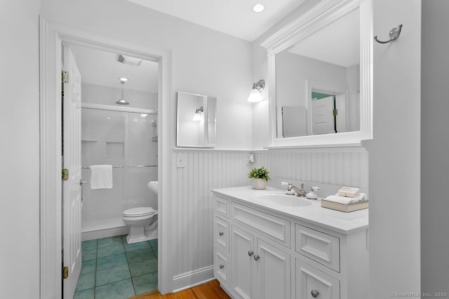20 Aspen Mill Rd, Ridgefield, CT 06877 - bathroom featuring a stall shower, vanity, and a wainscoted wall