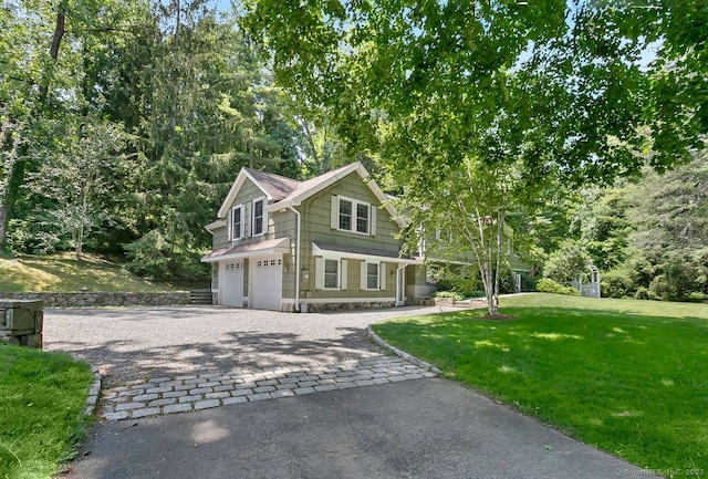 20 Aspen Mill Rd, Ridgefield, CT 06877 - view of front of property featuring decorative driveway, an attached garage, and a front lawn