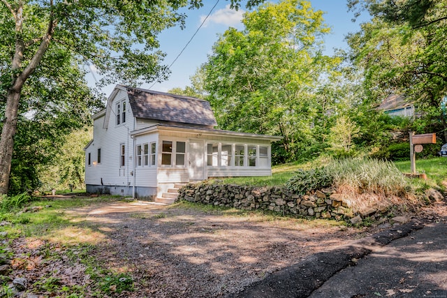 37 Quarry Rd, Beacon Falls, CT 06403 - colonial inspired home with roof with shingles, a sunroom, and entry steps