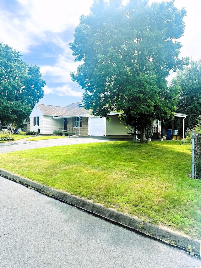 78 French St, Bristol, CT 06010 - view of front of property featuring asphalt driveway, an attached garage, and a front lawn