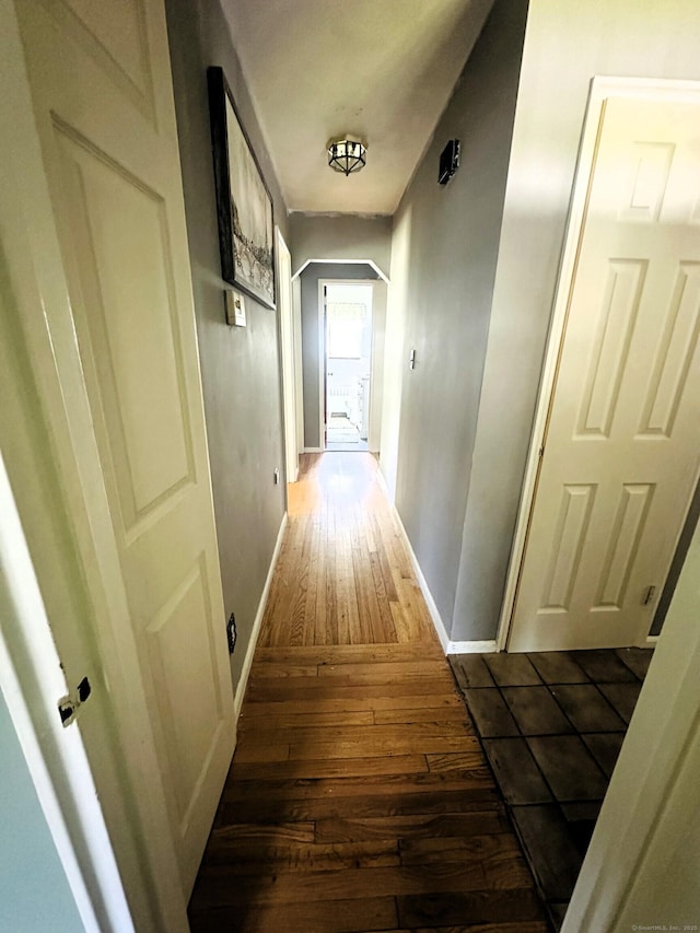 78 French St, Bristol, CT 06010 - hall featuring dark wood-style floors and arched walkways
