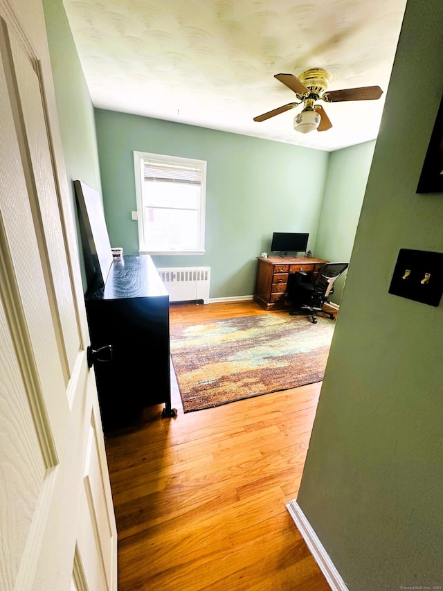78 French St, Bristol, CT 06010 - office area with radiator heating unit, wood finished floors, and a ceiling fan