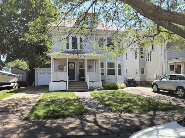 463 Washington Ave, West Haven, CT 06516 - view of front of property with covered porch, a garage, concrete driveway, and a front lawn