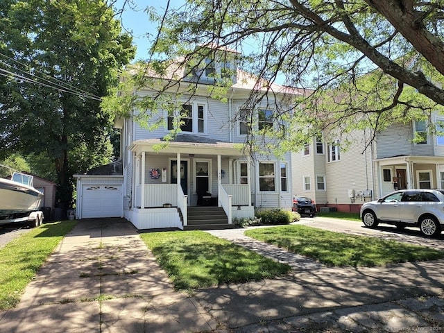 463 Washington Ave, West Haven, CT 06516 - traditional style home featuring a porch, a garage, concrete driveway, and a front yard