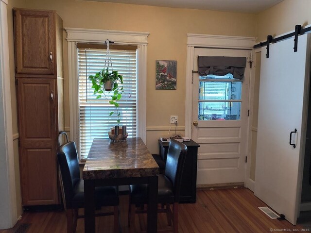 463 Washington Ave, West Haven, CT 06516 - dining space with dark wood-style floors and a barn door