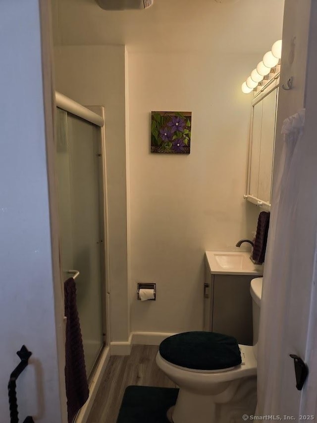 463 Washington Ave, West Haven, CT 06516 - bathroom featuring a shower stall, wood finished floors, and vanity