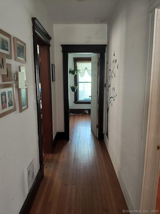 463 Washington Ave, West Haven, CT 06516 - corridor featuring dark wood-style floors and baseboards
