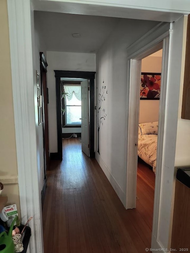 463 Washington Ave, West Haven, CT 06516 - hall with dark wood-style flooring and baseboards