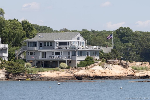 105 Beckett Ave Unit 105, Branford, CT 06405 - rear view of house with stairs, a deck with water view, and a view of trees
