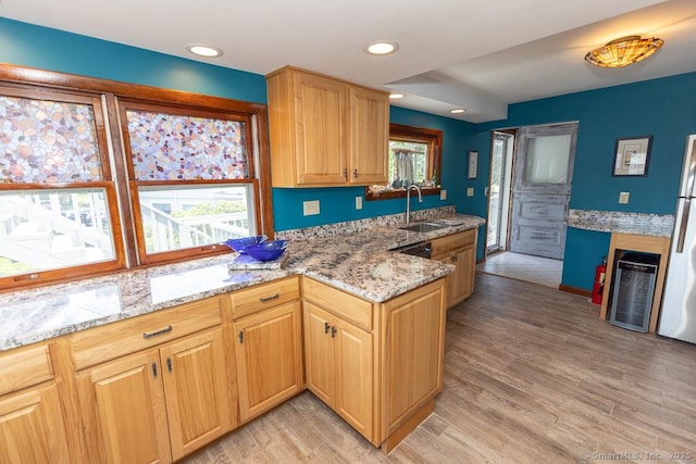 105 Beckett Ave Unit 105, Branford, CT 06405 - kitchen with light stone counters, light wood-style floors, recessed lighting, and wine cooler