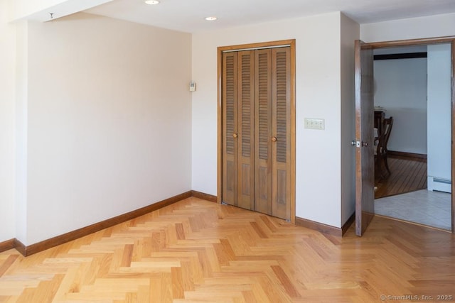 105 Beckett Ave Unit 105, Branford, CT 06405 - unfurnished bedroom featuring recessed lighting, a baseboard radiator, and a closet