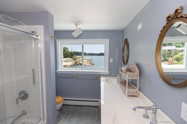 105 Beckett Ave Unit 105, Branford, CT 06405 - full bathroom with baseboard heating, wood finished floors, double vanity, and a water view