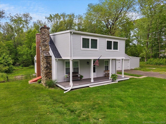 10 3rd Ave, Haddam, CT 06441 - view of front of property featuring a deck, a chimney, a garage, and driveway