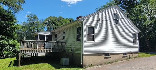 4 Clyne Ave, Waterbury, CT 06705 - view of home's exterior featuring a deck, a chimney, and a lawn