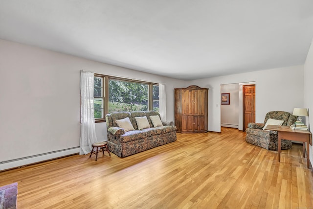 49 Nutmeg Ln, Shelton, CT 06484 - living area with light wood finished floors, baseboard heating, and a baseboard heating unit
