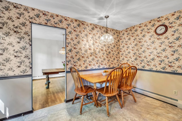 49 Nutmeg Ln, Shelton, CT 06484 - dining area with wallpapered walls, a baseboard radiator, and a chandelier