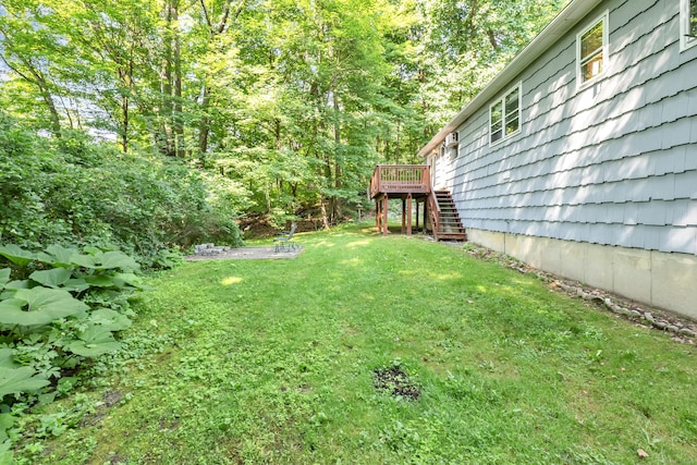 49 Nutmeg Ln, Shelton, CT 06484 - view of green lawn featuring stairway and a deck