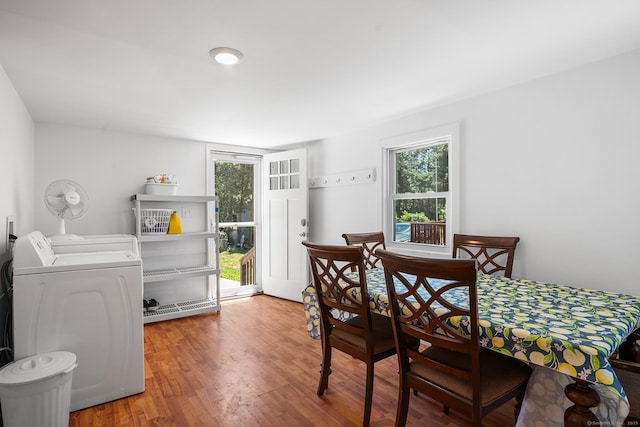 350 S Cherry St, Wallingford, CT 06492 - dining room featuring washer and dryer, plenty of natural light, and wood finished floors