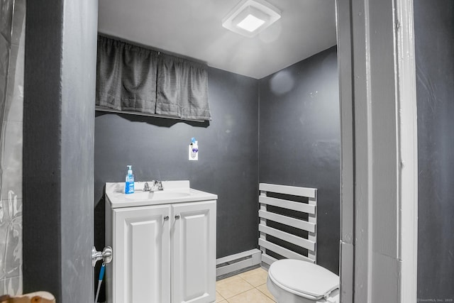350 S Cherry St, Wallingford, CT 06492 - half bath featuring vanity, tile patterned floors, and baseboard heating