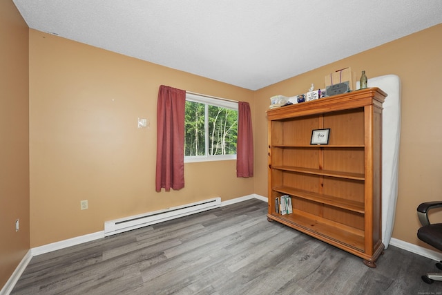 187 Lovers Ln Unit 4, Torrington, CT 06790 - unfurnished room with a baseboard heating unit and wood finished floors