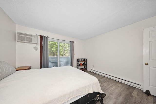 187 Lovers Ln Unit 4, Torrington, CT 06790 - bedroom featuring a baseboard radiator, wood finished floors, a wall unit AC, and access to exterior