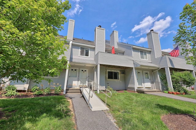 187 Lovers Ln Unit 4, Torrington, CT 06790 - townhome / multi-family property featuring a front lawn, a balcony, and a chimney