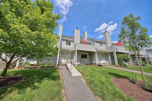 187 Lovers Ln Unit 4, Torrington, CT 06790 - townhome / multi-family property featuring a chimney, a front yard, and a balcony