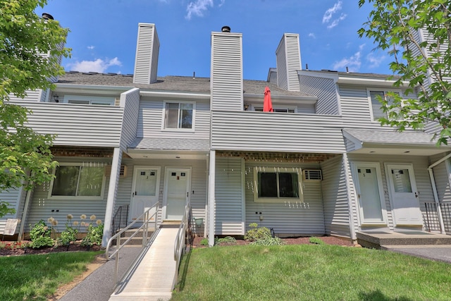 187 Lovers Ln Unit 4, Torrington, CT 06790 - townhome / multi-family property with a front lawn, a chimney, and a balcony