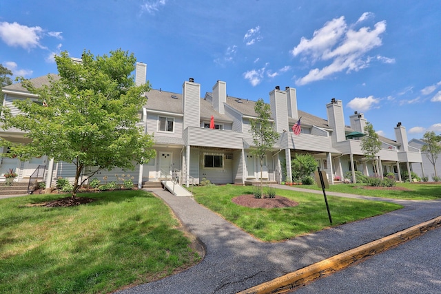 187 Lovers Ln Unit 4, Torrington, CT 06790 - view of front of home with a residential view and a front yard