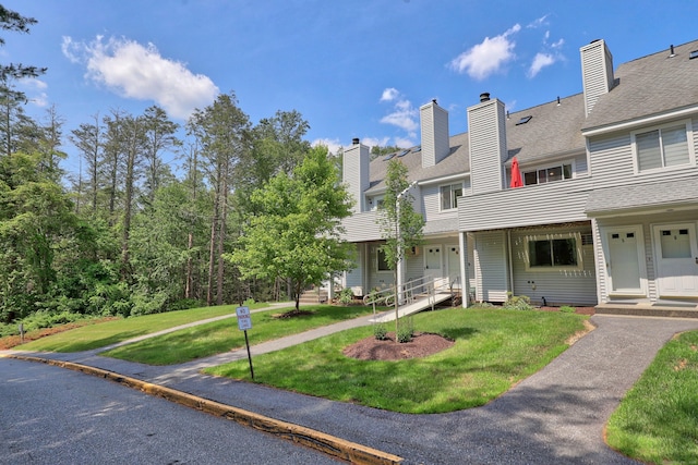 187 Lovers Ln Unit 4, Torrington, CT 06790 - townhome / multi-family property with a front yard and a chimney