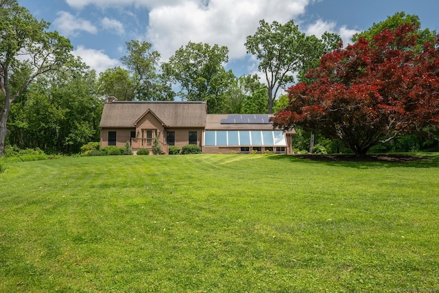 79 Ben Whitney Ln, Bridgewater, CT 06752 - ranch-style house with solar panels and a front yard