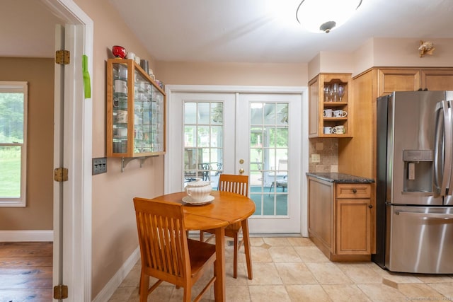 79 Ben Whitney Ln, Bridgewater, CT 06752 - kitchen featuring stainless steel fridge with ice dispenser, plenty of natural light, french doors, and brown cabinetry