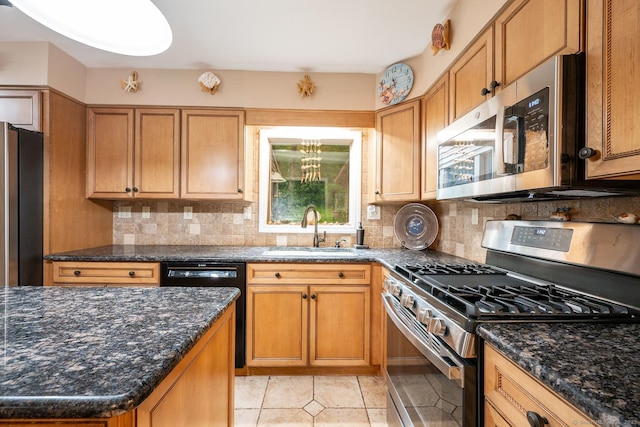 79 Ben Whitney Ln, Bridgewater, CT 06752 - kitchen with stainless steel appliances, decorative backsplash, dark stone countertops, and light tile patterned floors