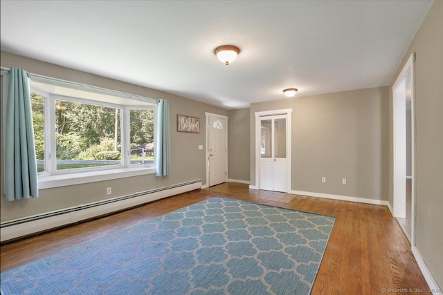 57 Lakeview Hts, Lebanon, CT 06249 - foyer entrance featuring baseboard heating and wood finished floors