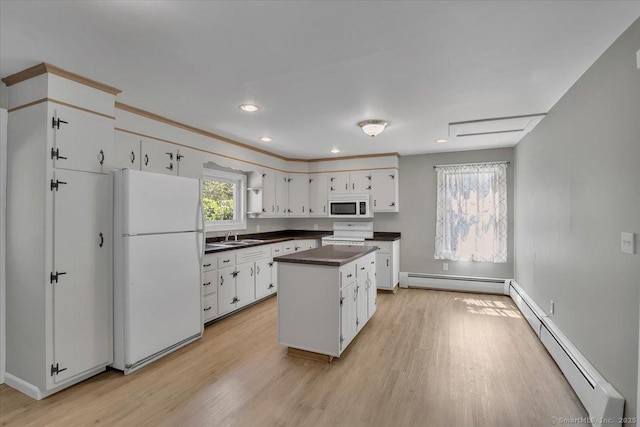 57 Lakeview Hts, Lebanon, CT 06249 - kitchen with white appliances, dark countertops, a baseboard heating unit, light wood-type flooring, and recessed lighting