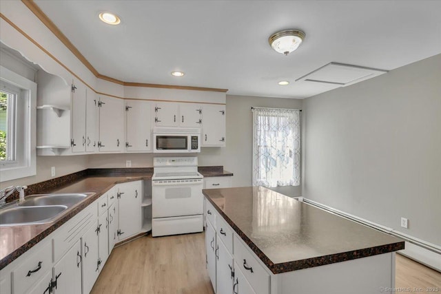 57 Lakeview Hts, Lebanon, CT 06249 - kitchen featuring white appliances, dark countertops, a kitchen island, light wood finished floors, and white cabinets