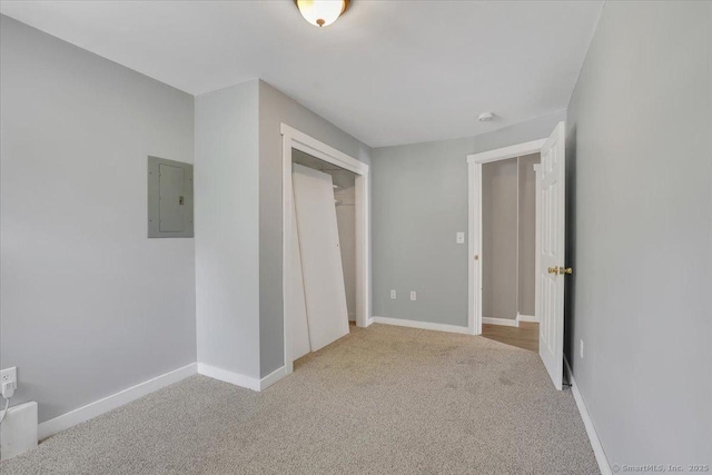 57 Lakeview Hts, Lebanon, CT 06249 - unfurnished bedroom featuring electric panel, light carpet, and a closet