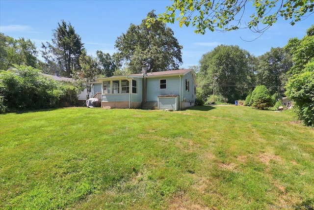 57 Lakeview Hts, Lebanon, CT 06249 - rear view of house with a yard